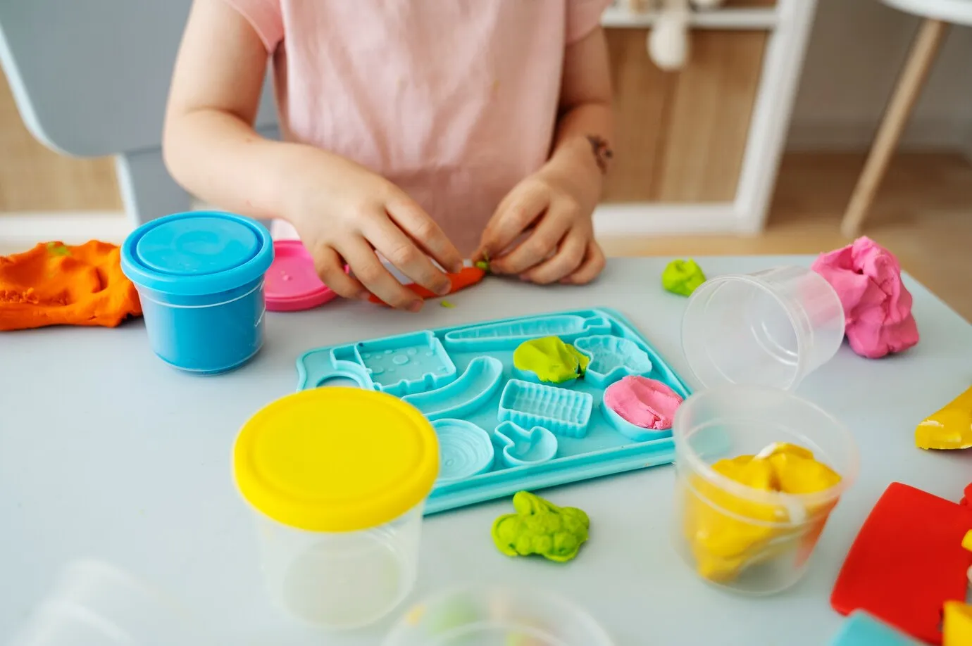 high-angle-kid-playing-indoors_23-2149513089